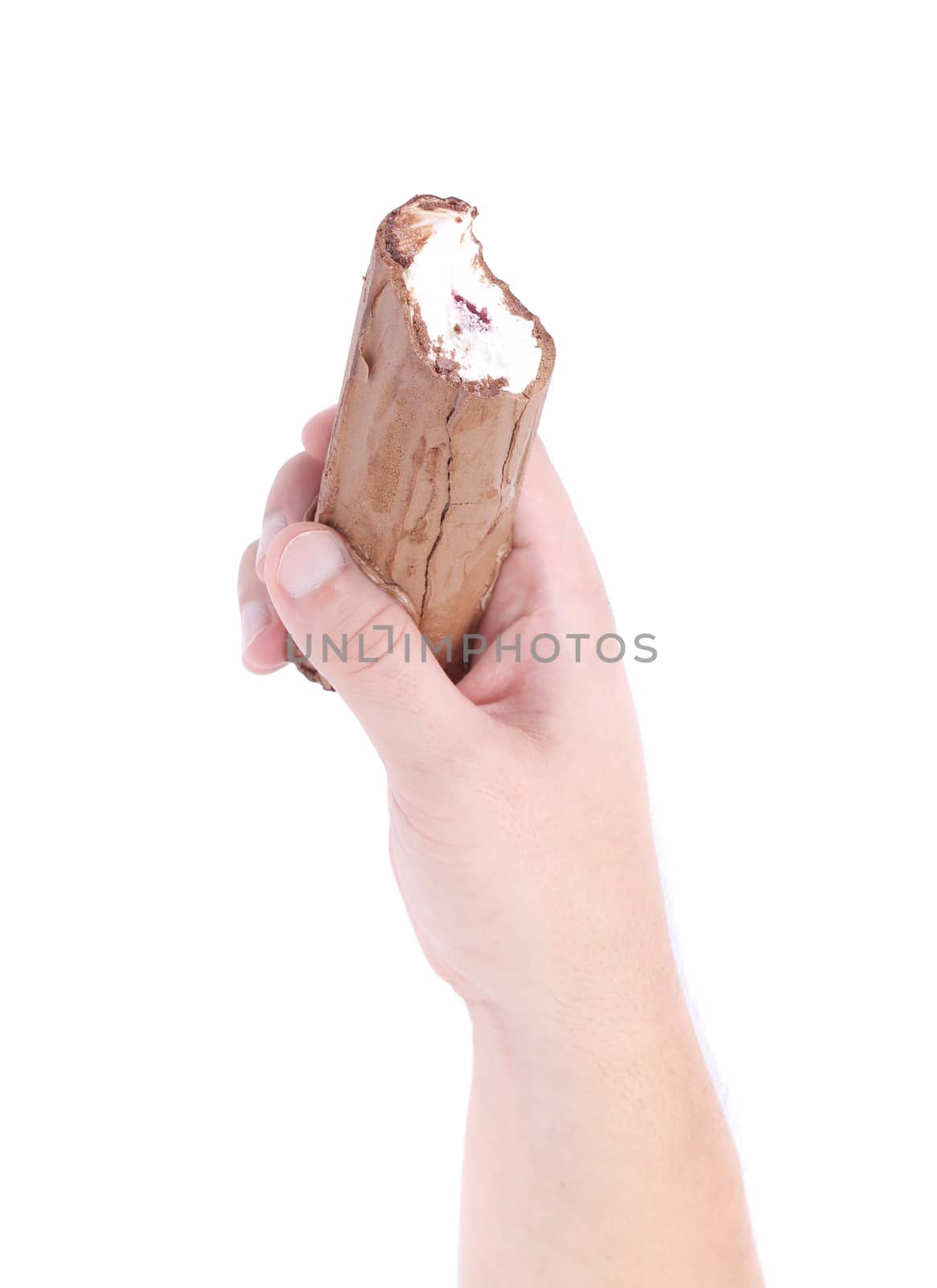 hand holds a roll of chocolate ice cream. Isolated on a white background