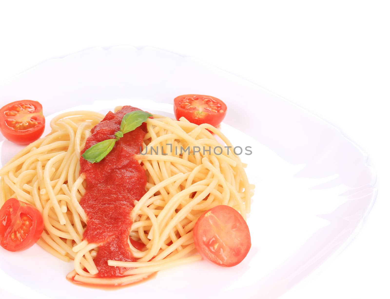 close up of spaghetti with tomato sauce and basil. isolated on a white background