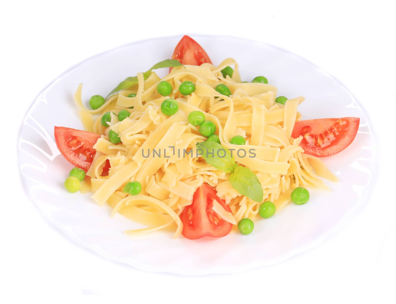 Pasta with green peas on plate close up. Isolated on a white background.