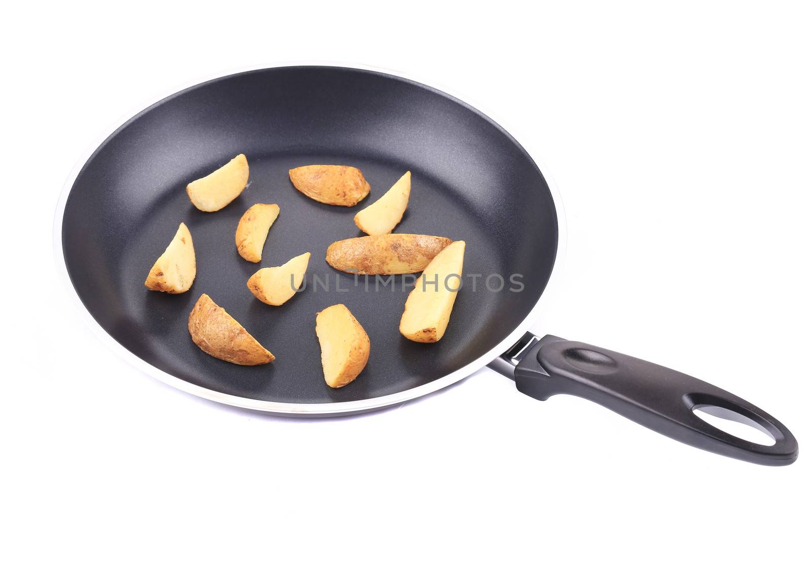 Fried potatoes on a black frying pan. On a white background.