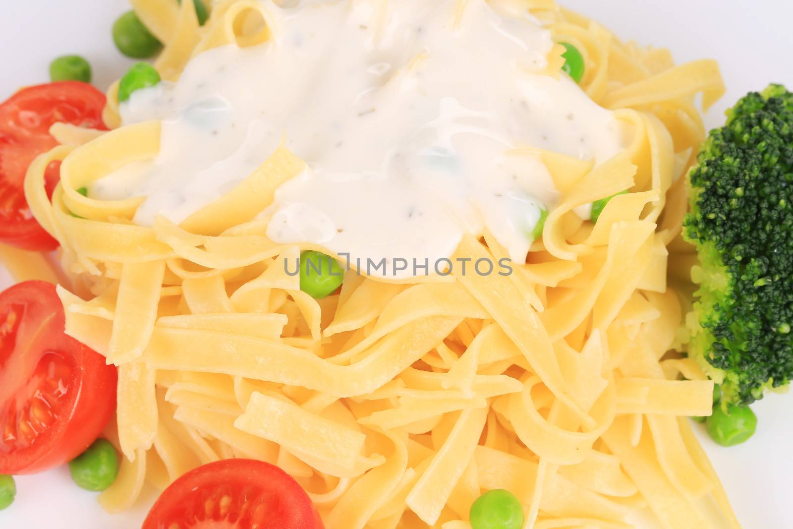 Pasta with dressing and green beans. Whole background.