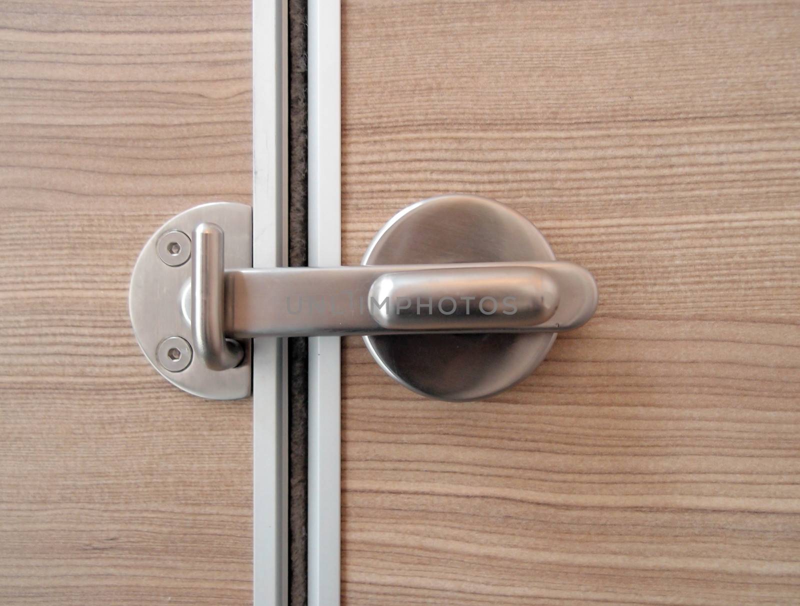 The part of wooden door with metal lock