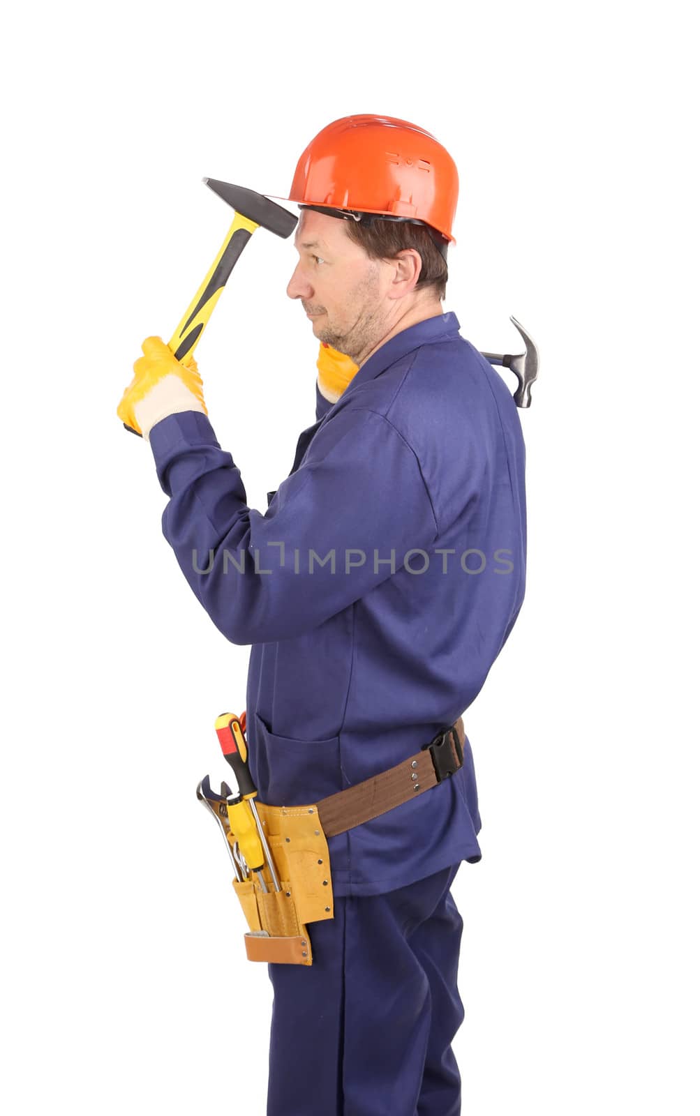 Worker in hard hat holding hammers. Isolated on a white background.