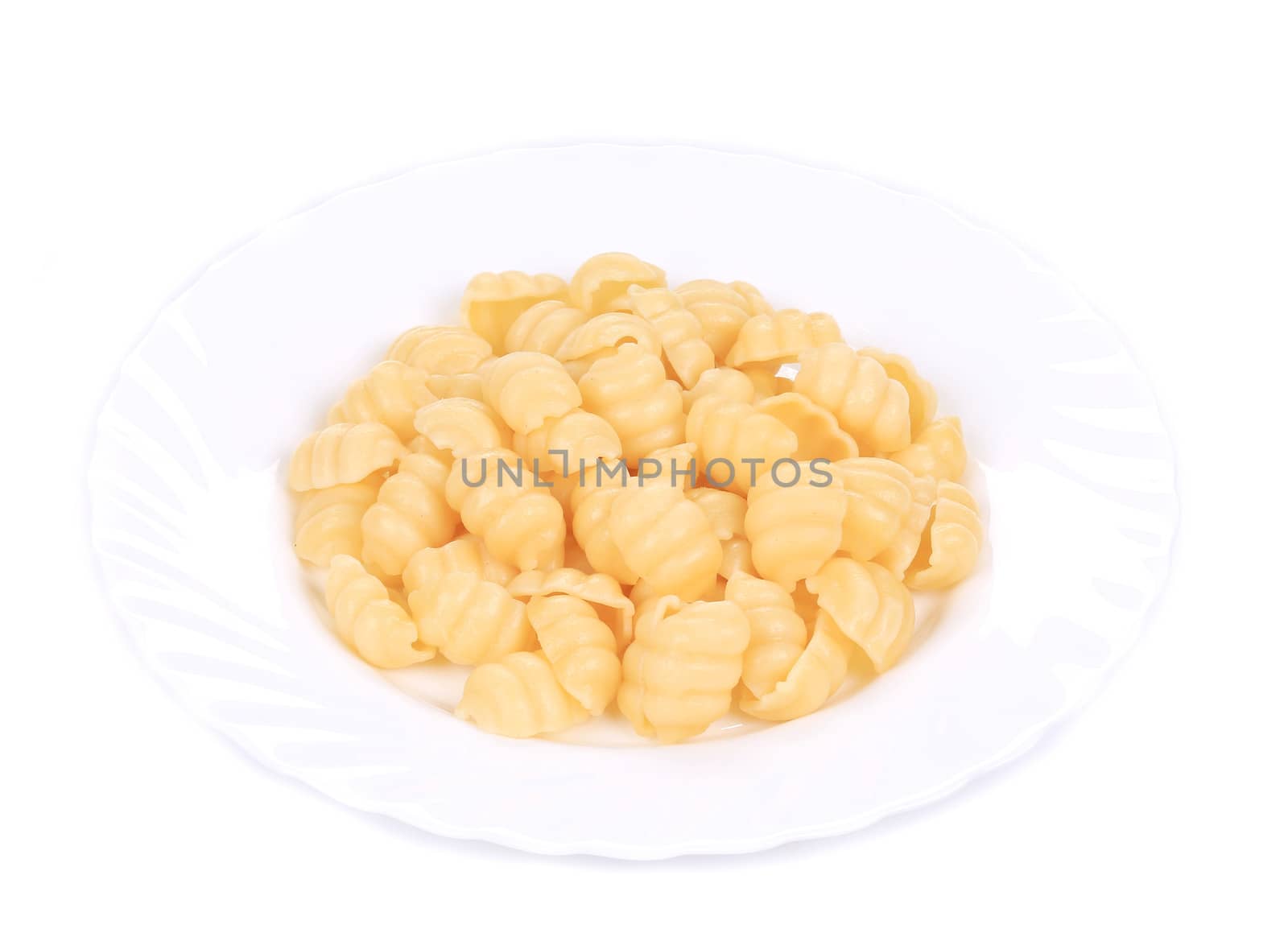 Pasta on the plate. Isolated on white background.