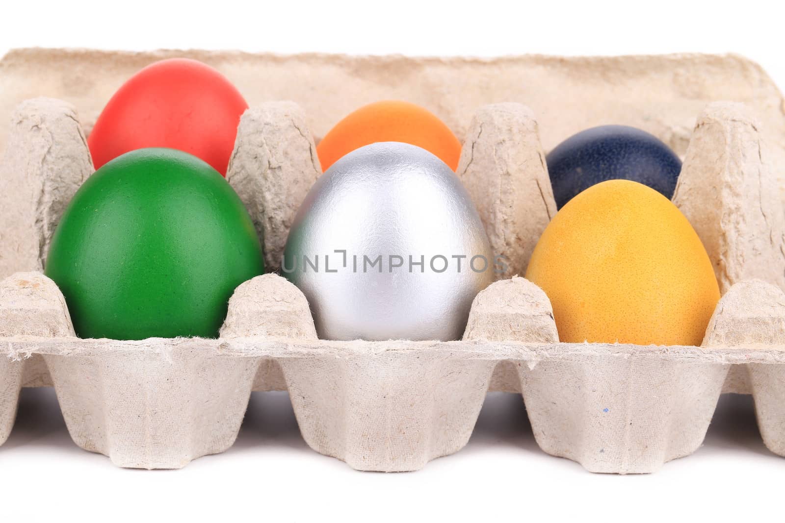 Easter eggs in a box. On a white background.