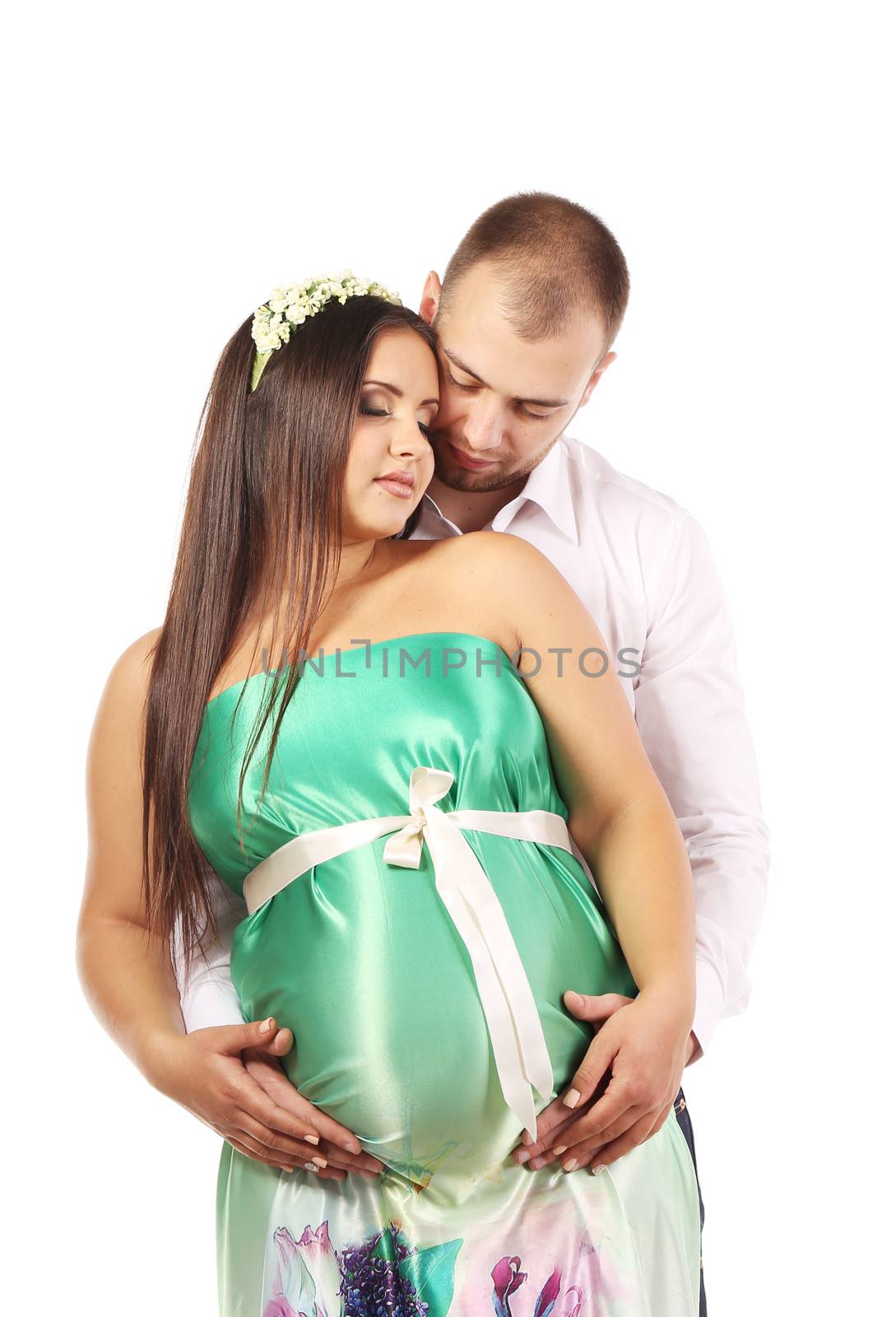 View of a beautiful pregnant girl with her husband. Isolated on a white background