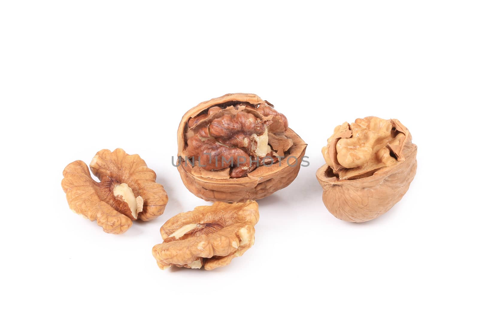 Pile of walnuts. Isolated on a white background.