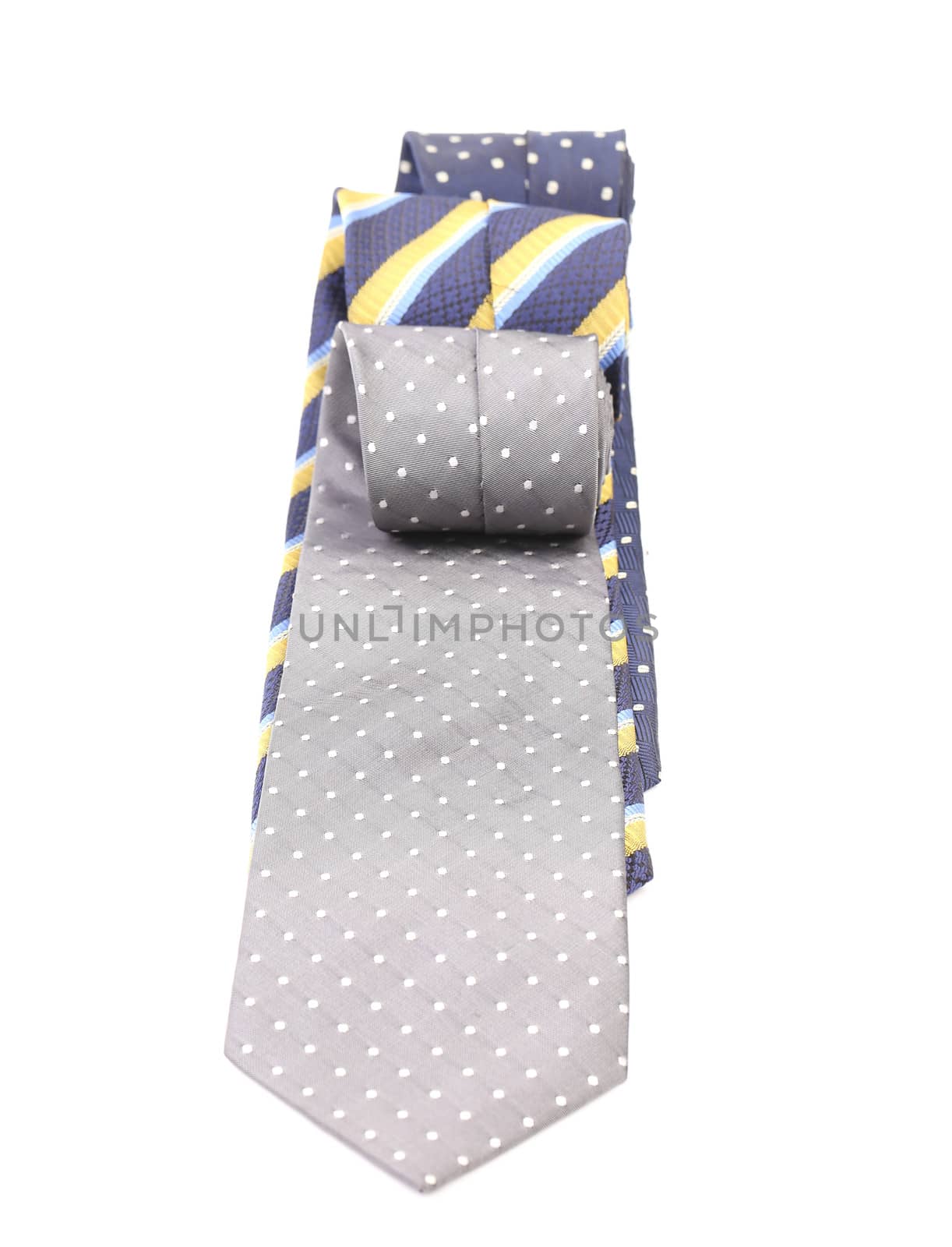 Three rolled multi-colored tie. Isolated on white background