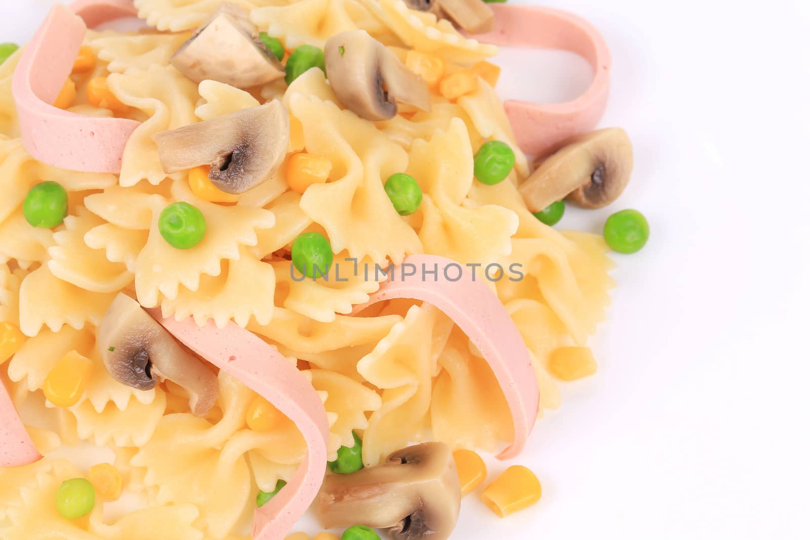 Pasta with mushrooms and sausage. Isolated on a white background.