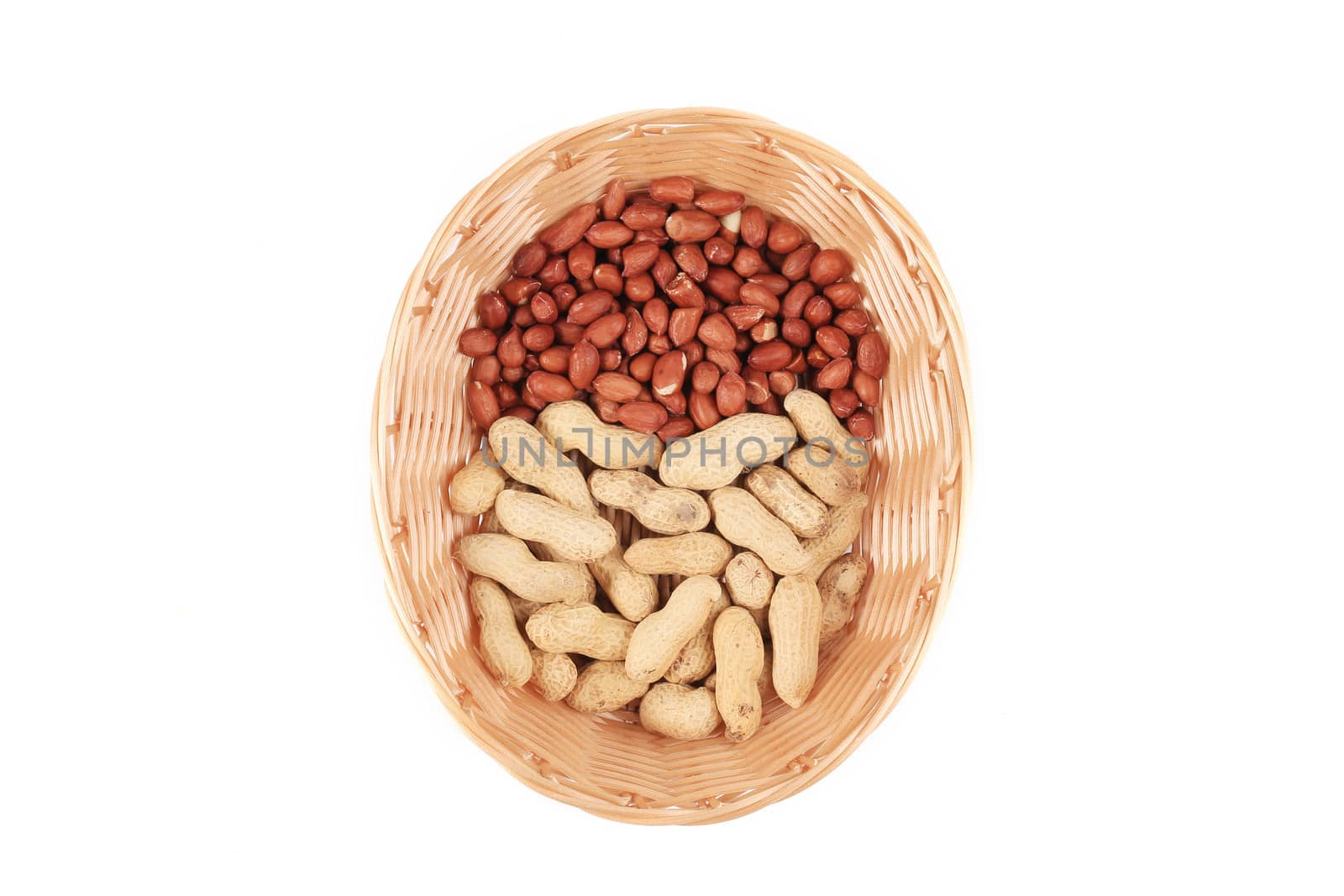 Basket full with peanuts. Isolated on a white background
