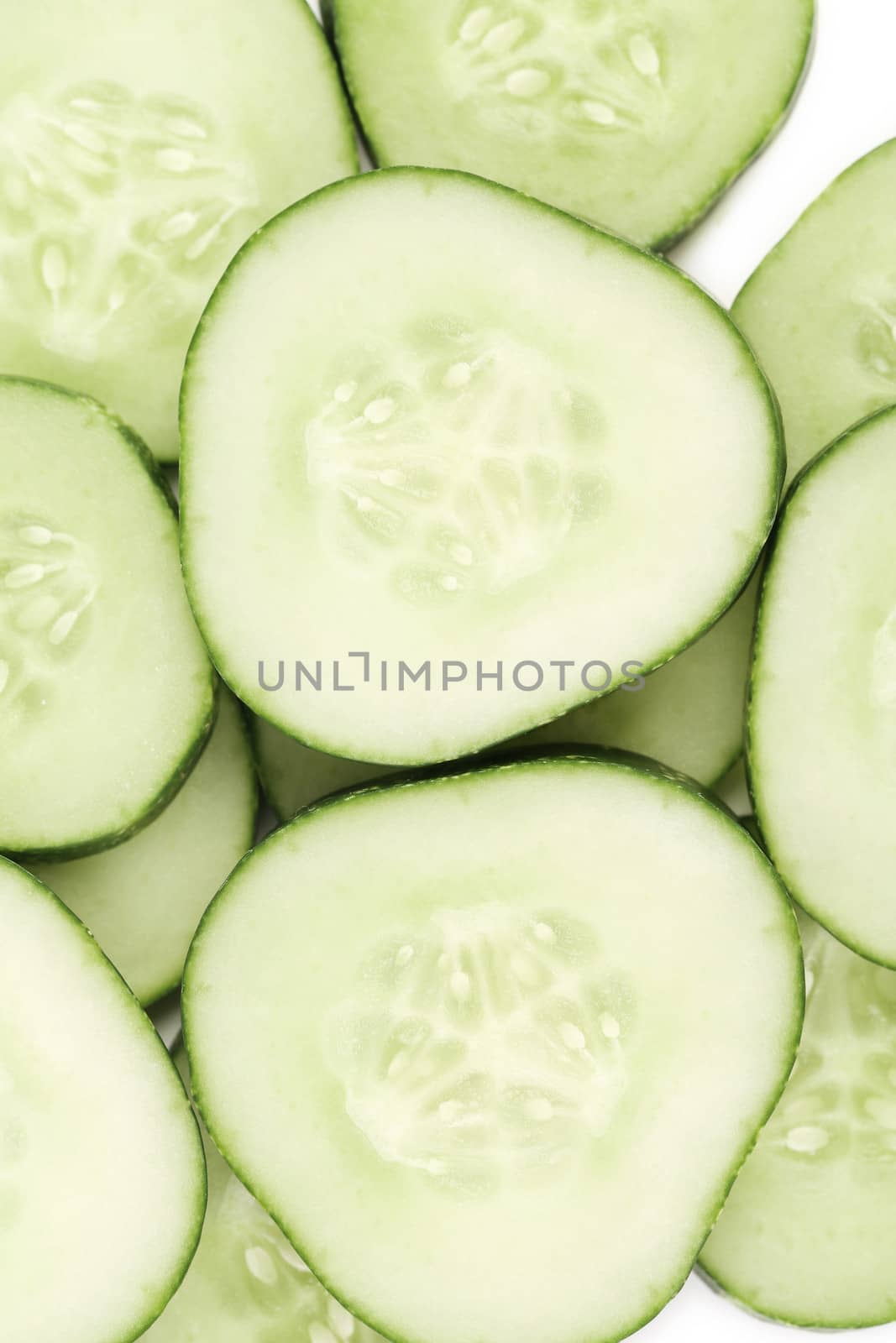 Close up fresh green sliced cucumber. Whole background.