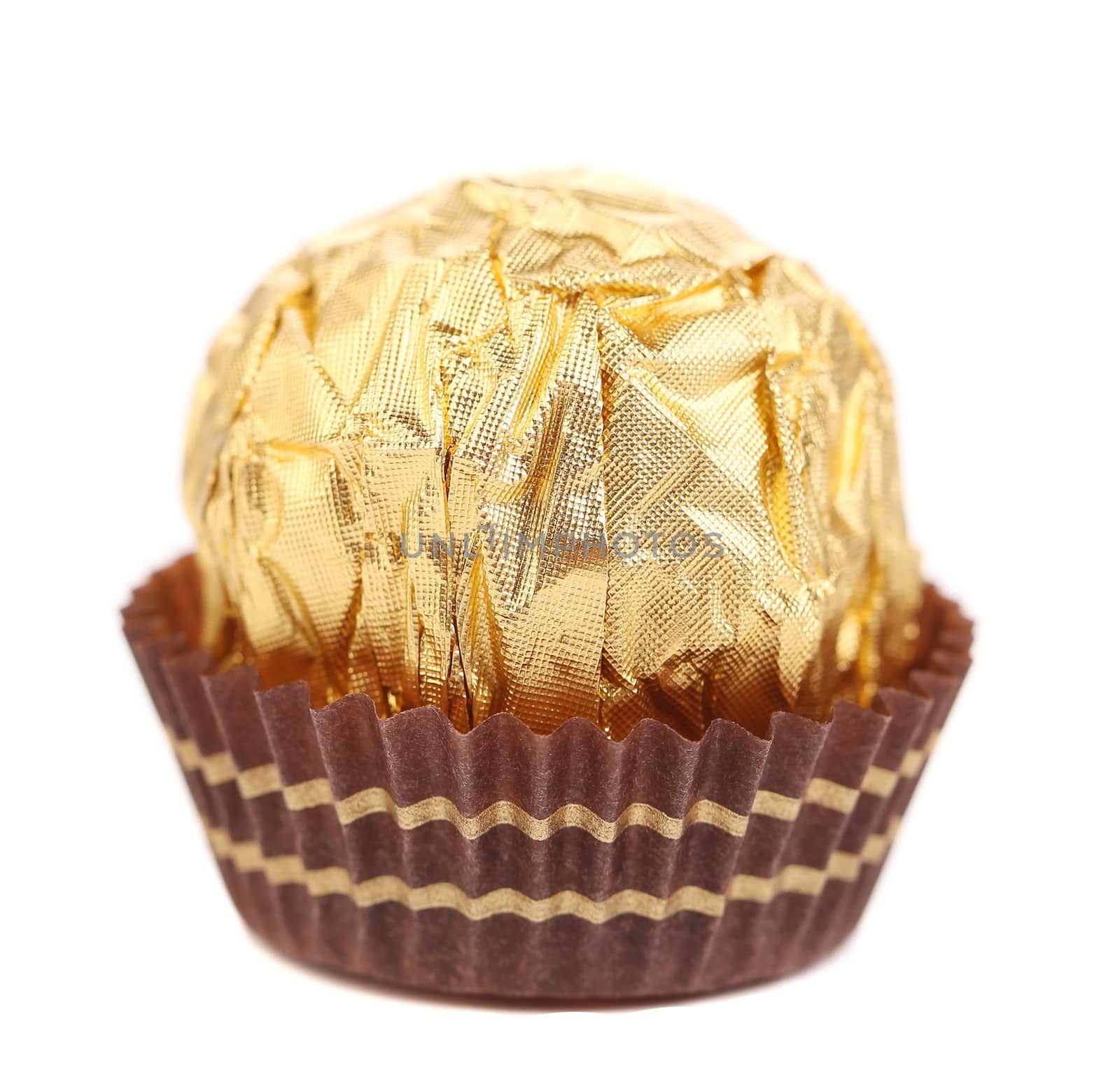 close up of chocolate gold bonbon. isolated on a white background