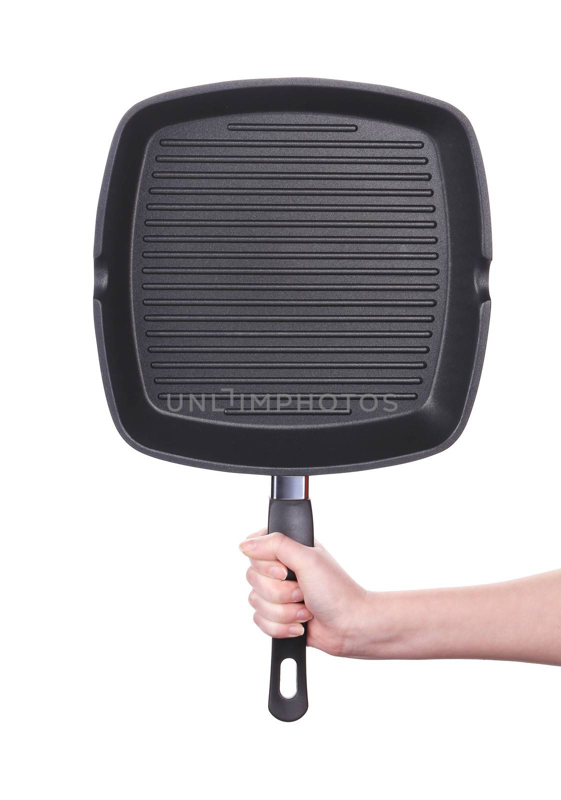 Hand holds a black frying grill pan. Isolated on a white background