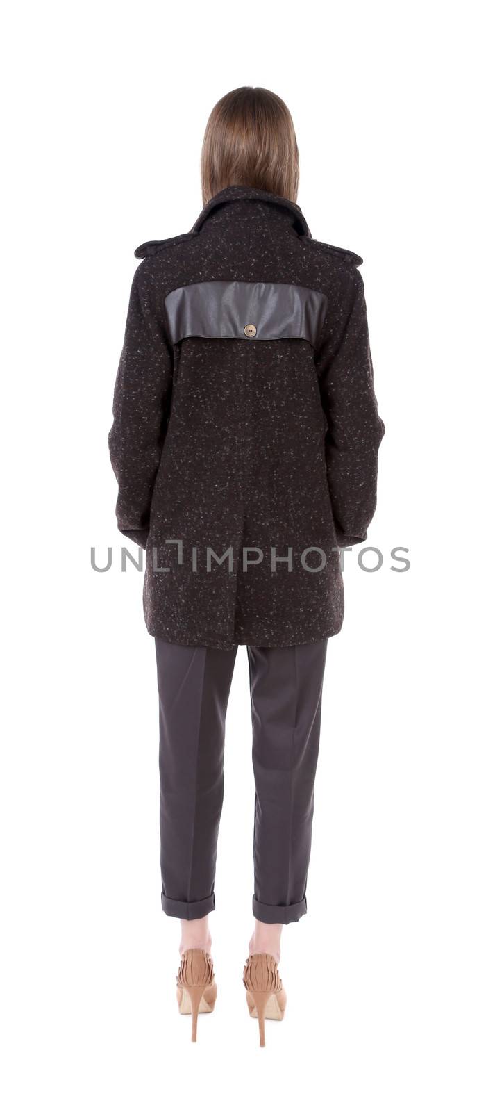 Beautiful fashionable model in coat. Isolated on a white background.