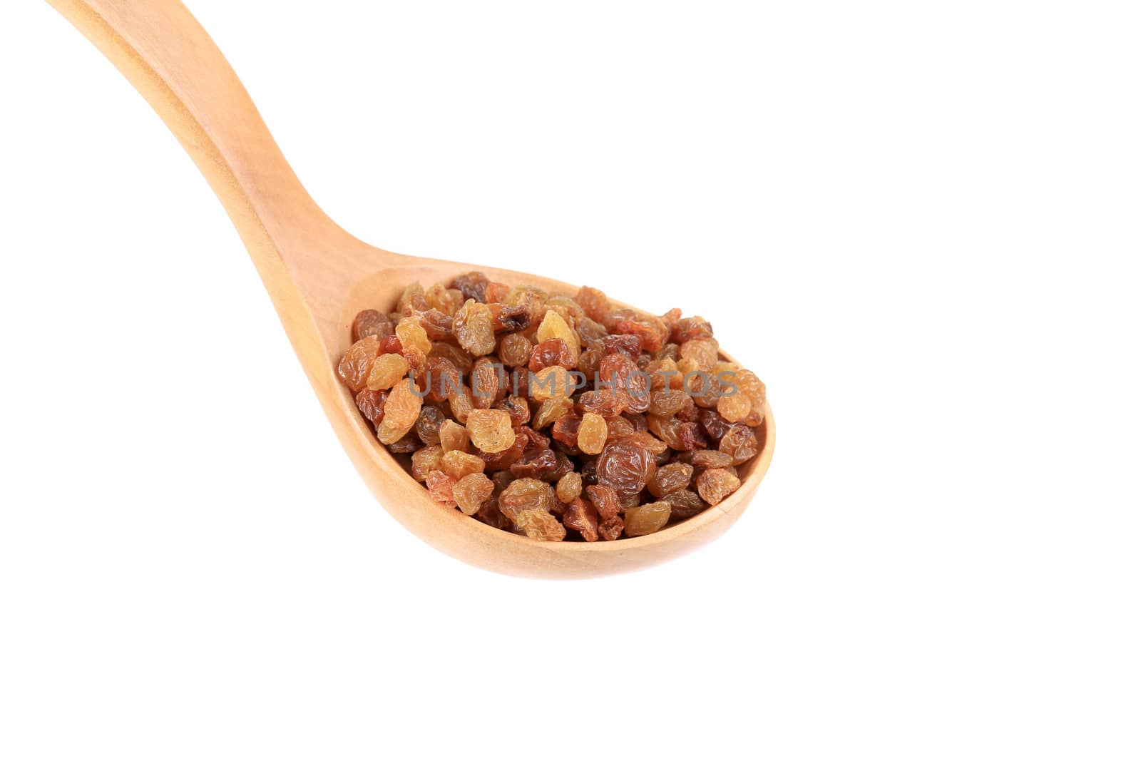 Wooden spoon with raisins. Isolated on a white background.