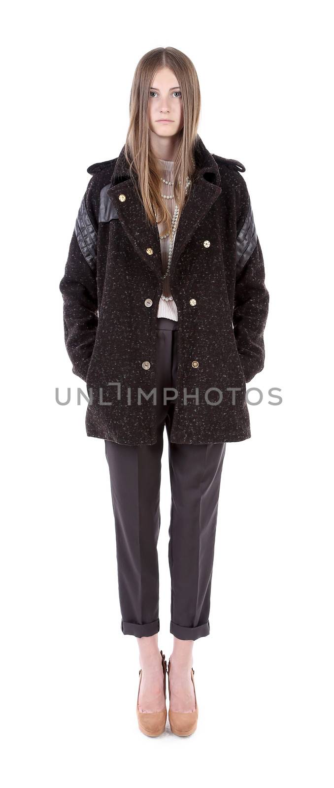 Beautiful fashionable model in coat. Isolated on a white background.