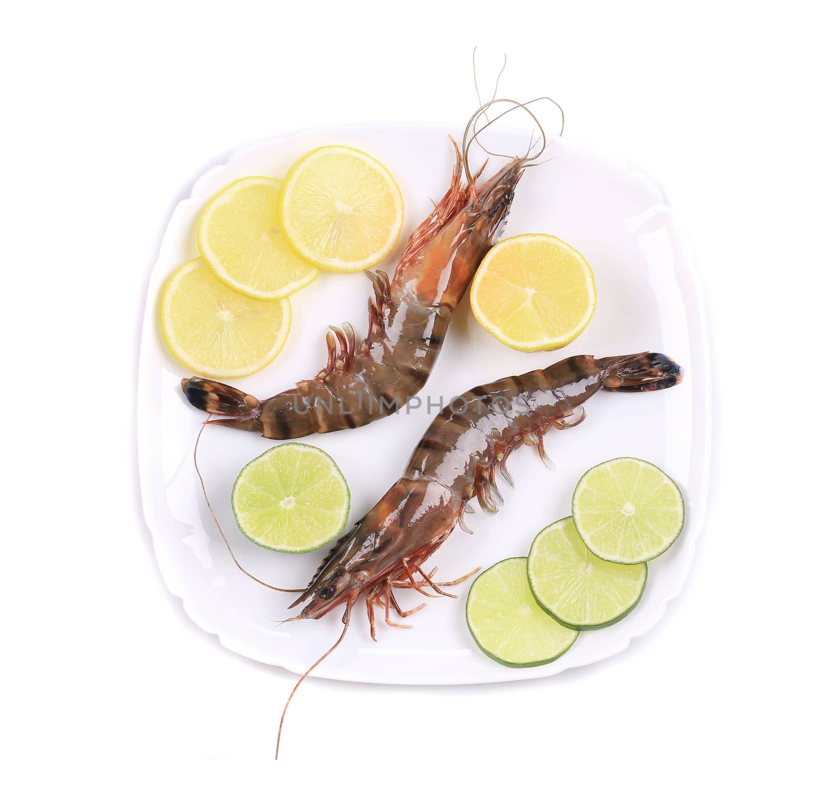 Black tiger shrimps with lemon. Isolated on a white background.