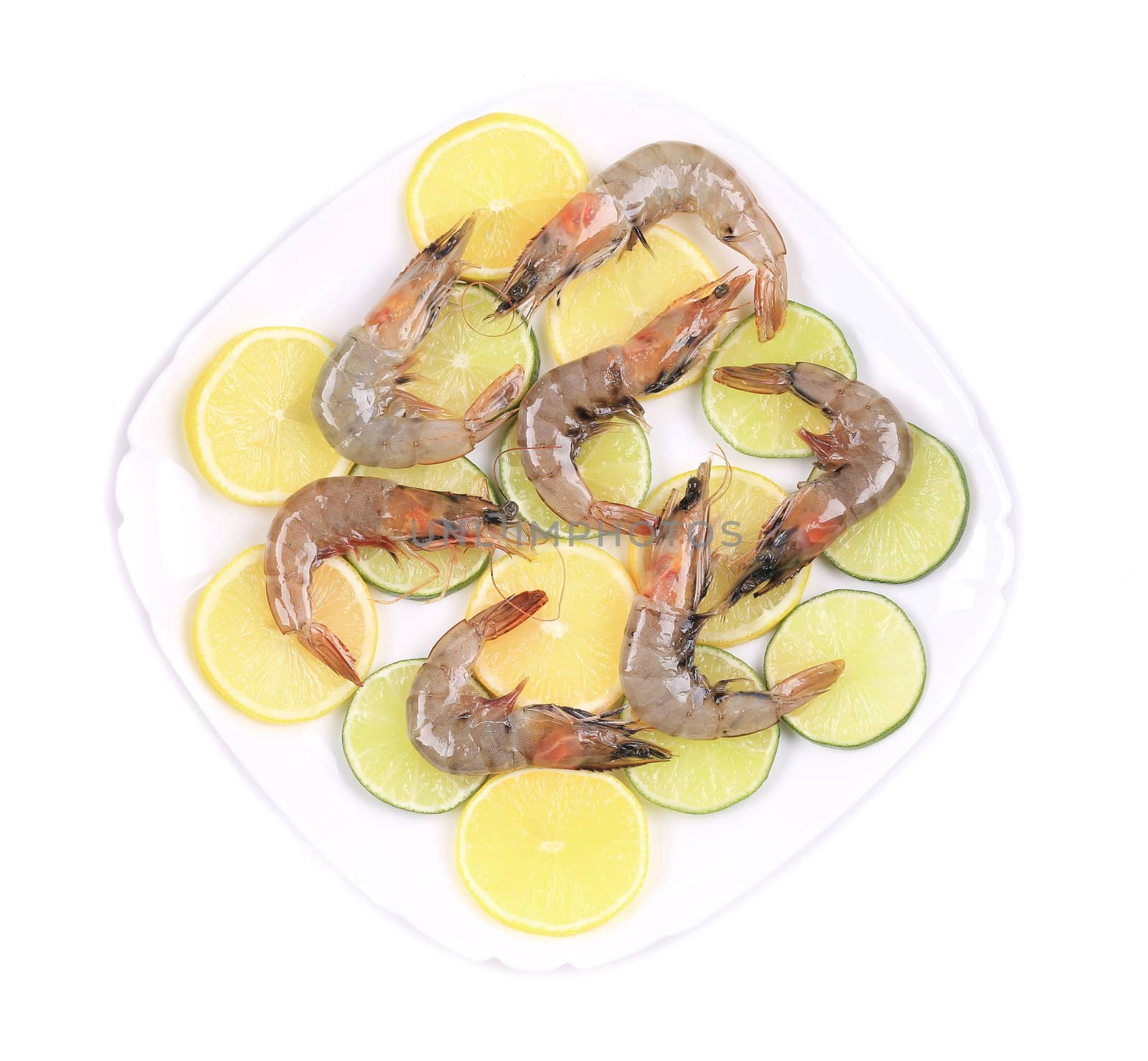 Raw prawns on lemon slices. Isolated on a white background.