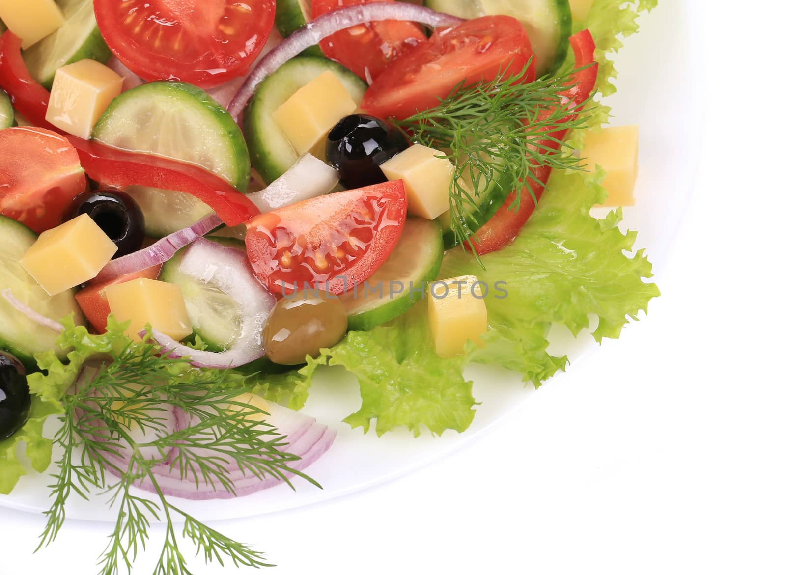 Greek salad with cheese. Isolated on a white background.
