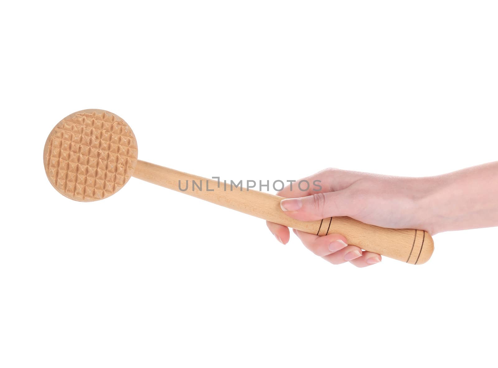 Hand holds wooden meat tenderizer. Isolated on a white background.