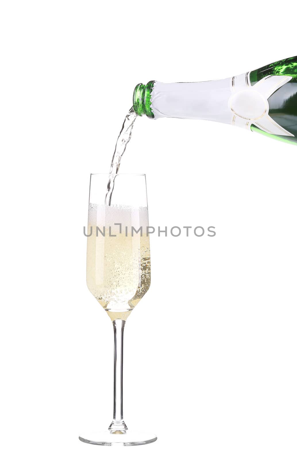 Champagne pouring in a glass. Isolated on a white background.