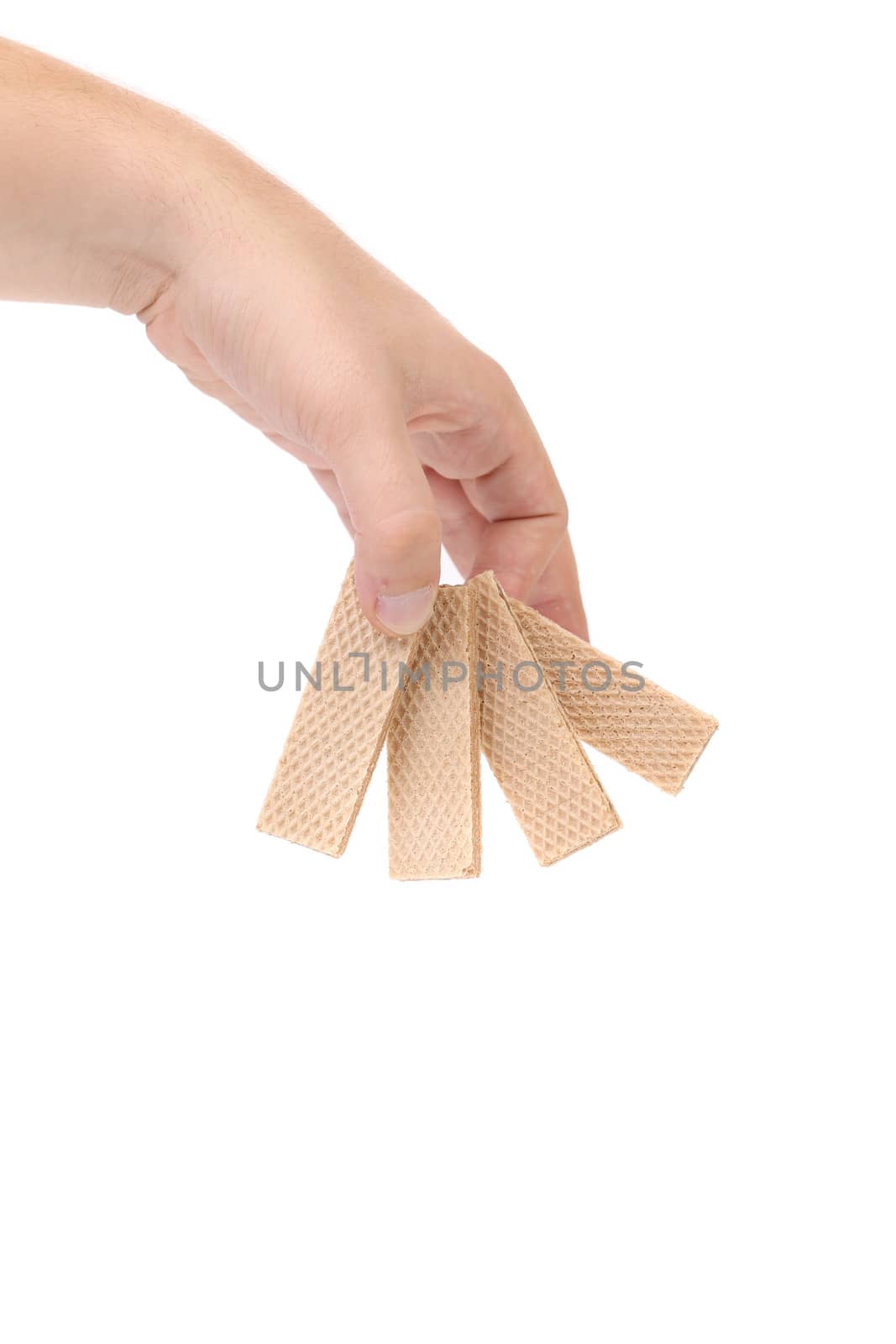 Hand holds tasty waffles. Isolated on a white background.