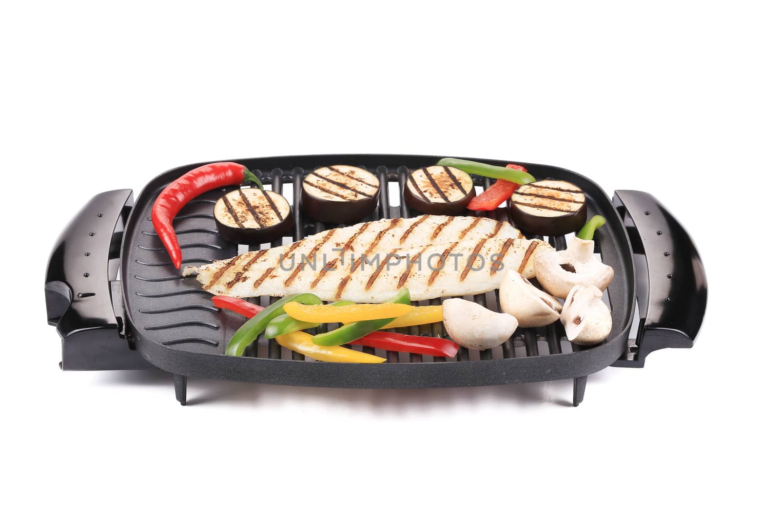Grilled seabass with vegetables. Isolated on a white background.