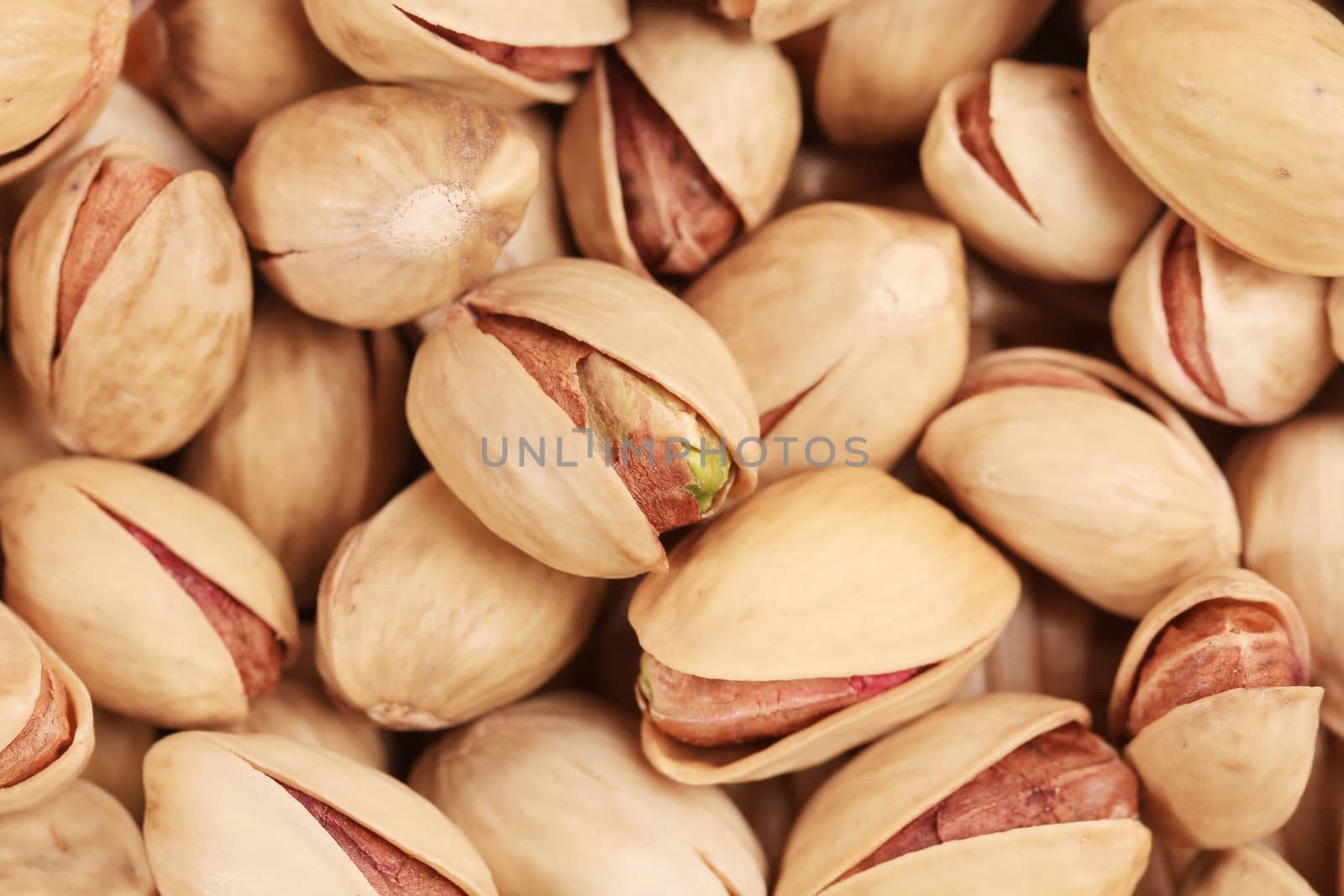 Pistachios background. Isolated on a white background.