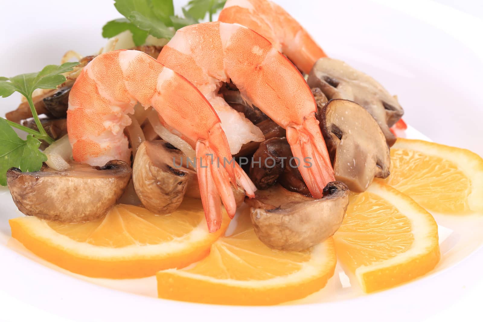 Shrimp salad with lemons and mushrooms. Isolated on a white background.