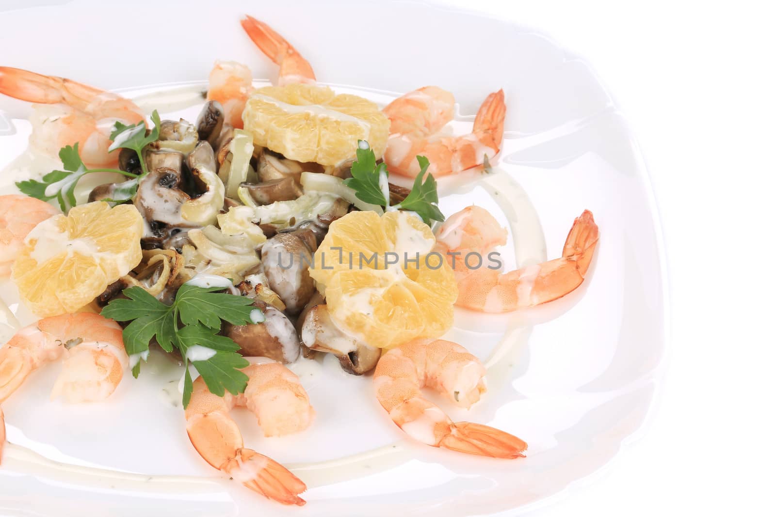Shrimp salad with mushrooms and white sauce. Isolated on a white background.