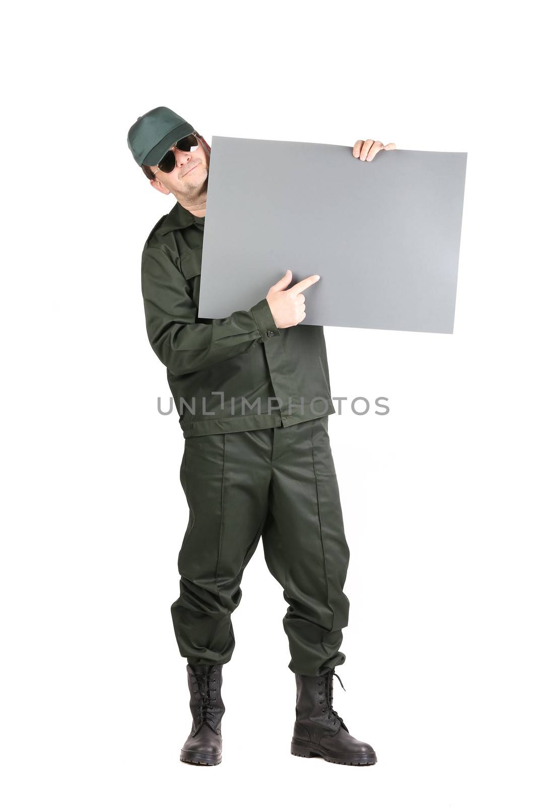 Man in workwear holds paper sheet. by indigolotos