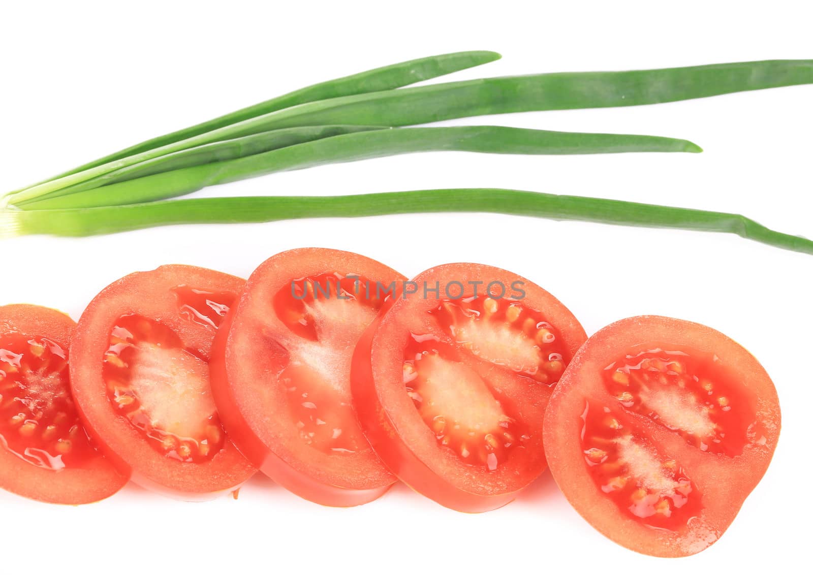 Spring onions and sliced tomatoes. Isolated on a white background.