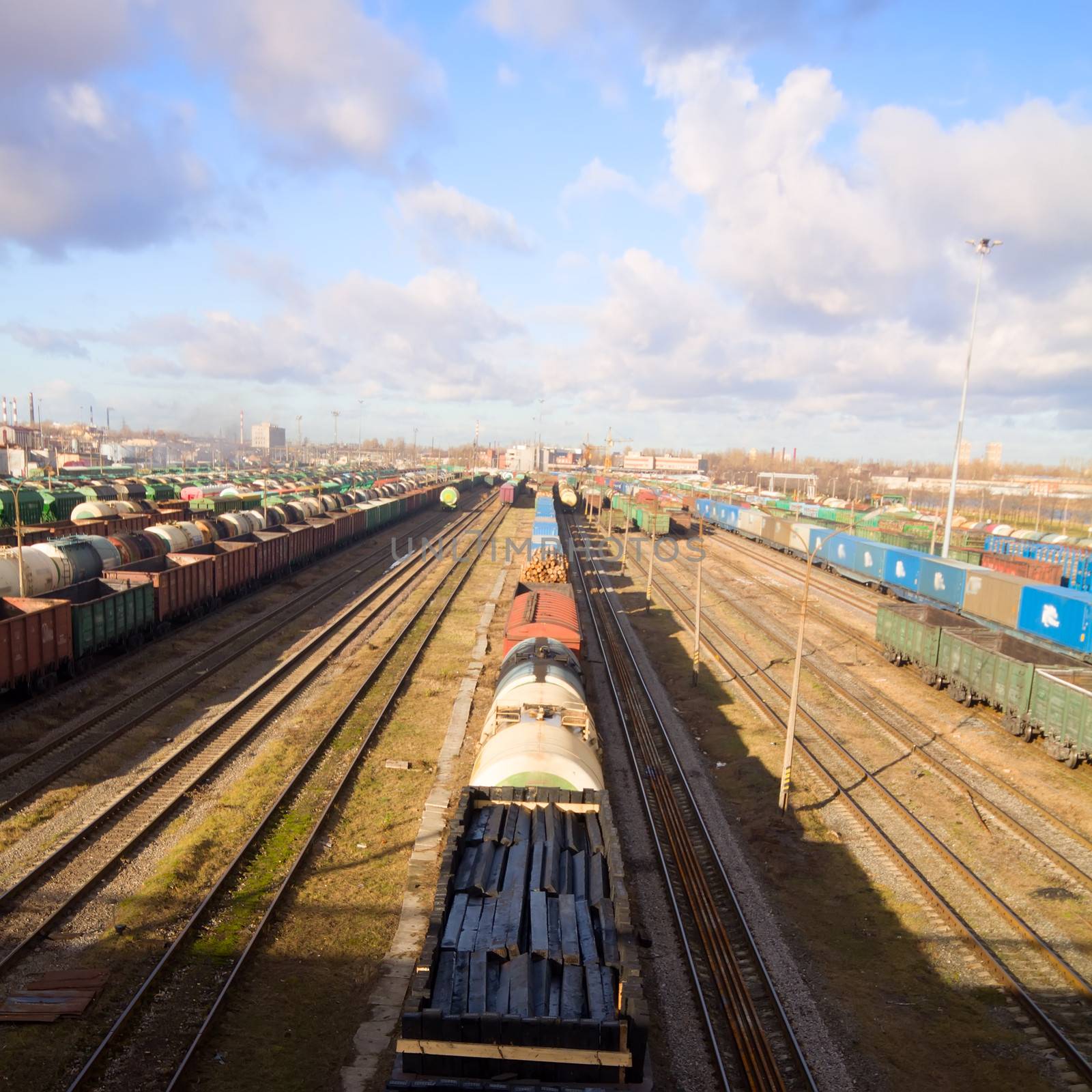Freight train with color cargo containers in depot