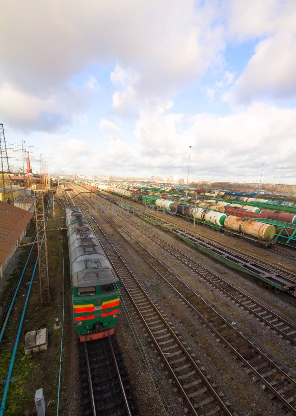 Freight train with color cargo containers in depot