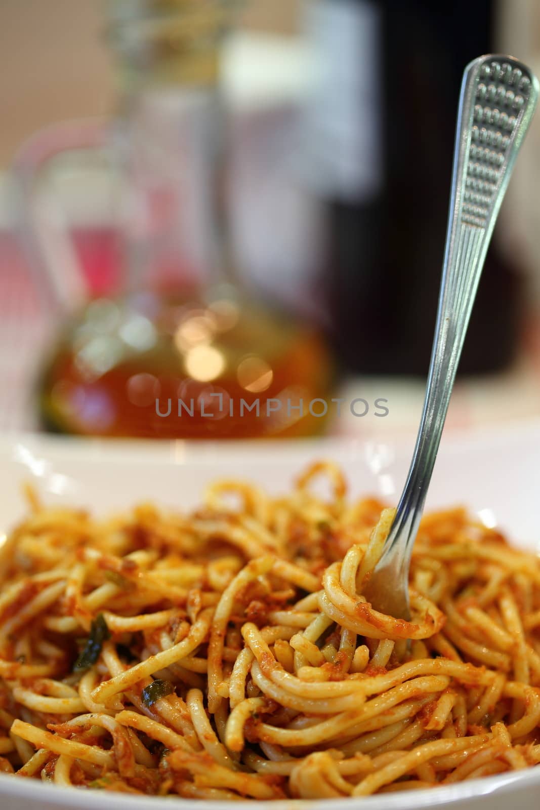 spaghetti a la putaneska and fork, close up