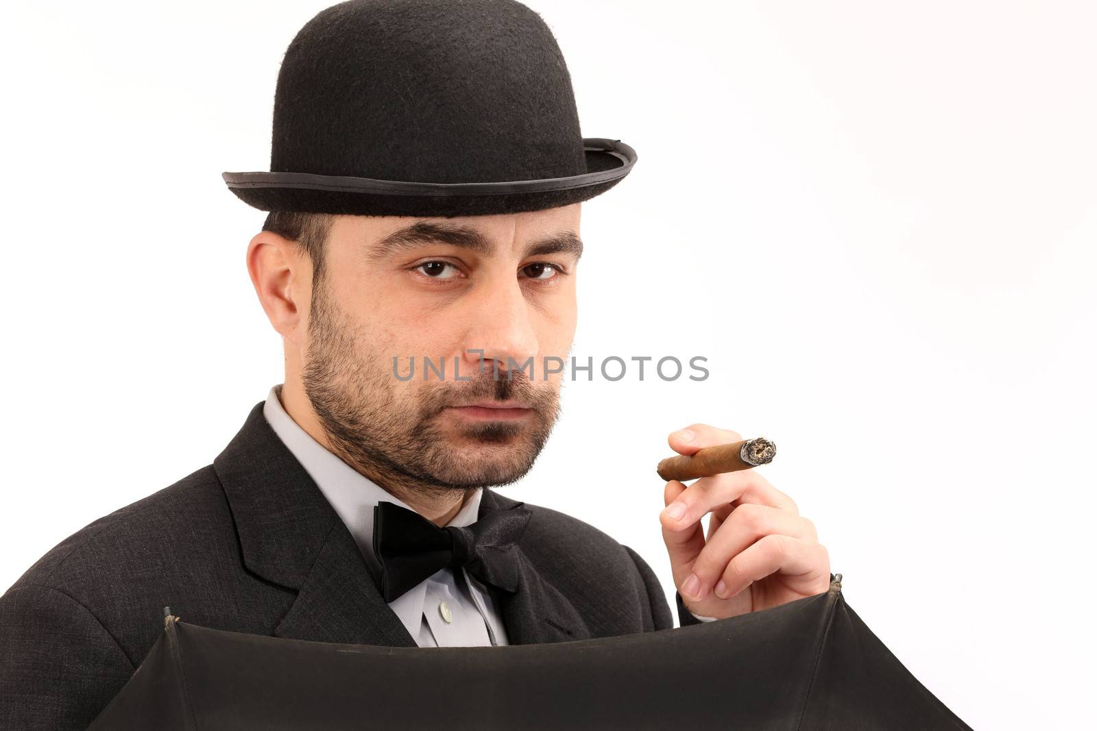 man with bowler hat, cigar and  umbrella 