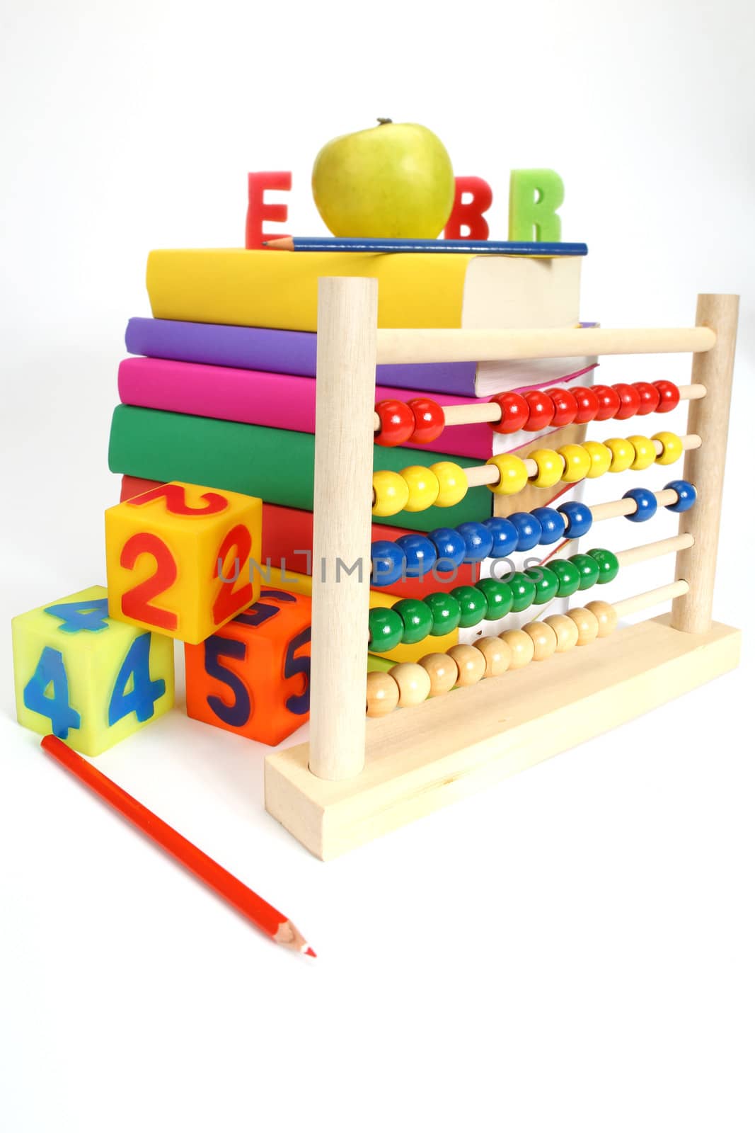 pile of color books and abacus on white