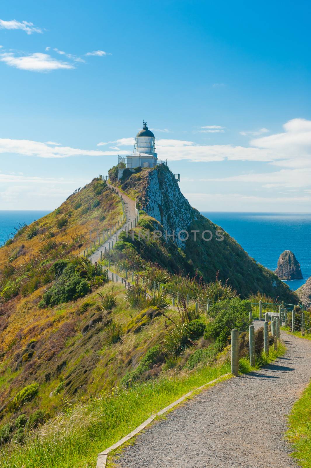 Lighthouse on Nugget Point. It is located in the Catlins area on the Southern Coast of New Zealand, Otago region. The Lighthouse is surrounded by small rock islands, nuggets