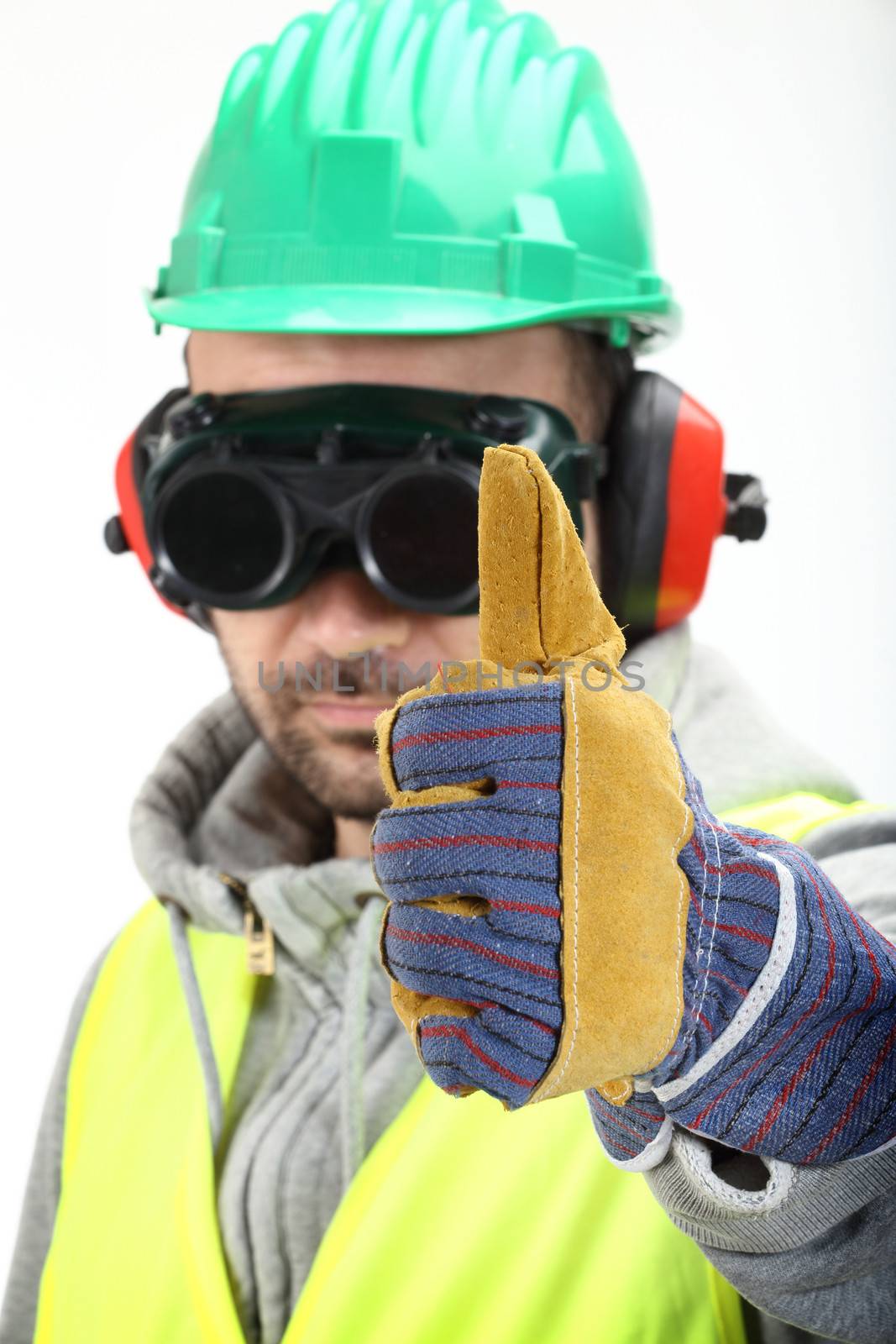 Worker with protective gear and thumbs up 