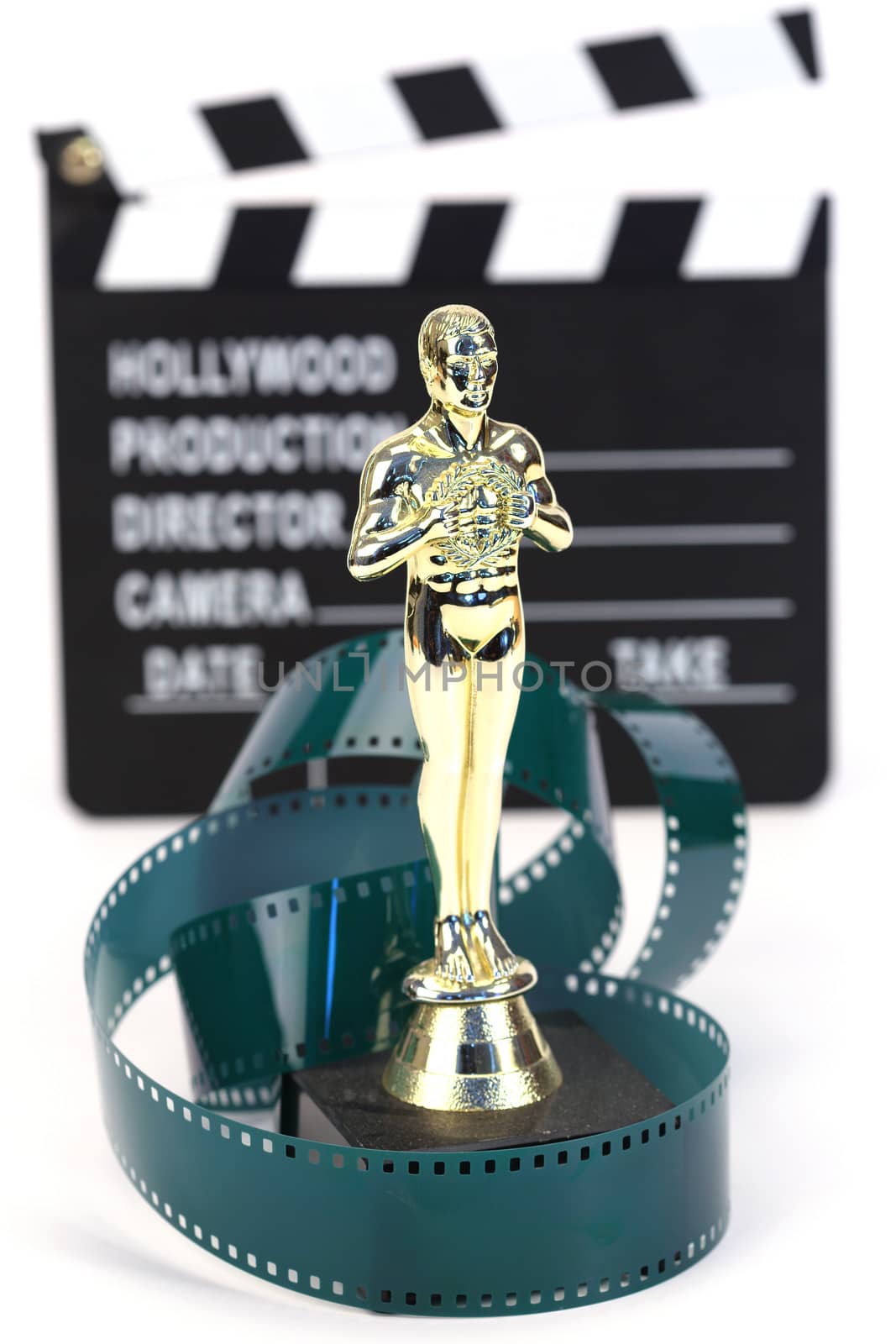 fake Oscar award and movie clapper board , shallow dof