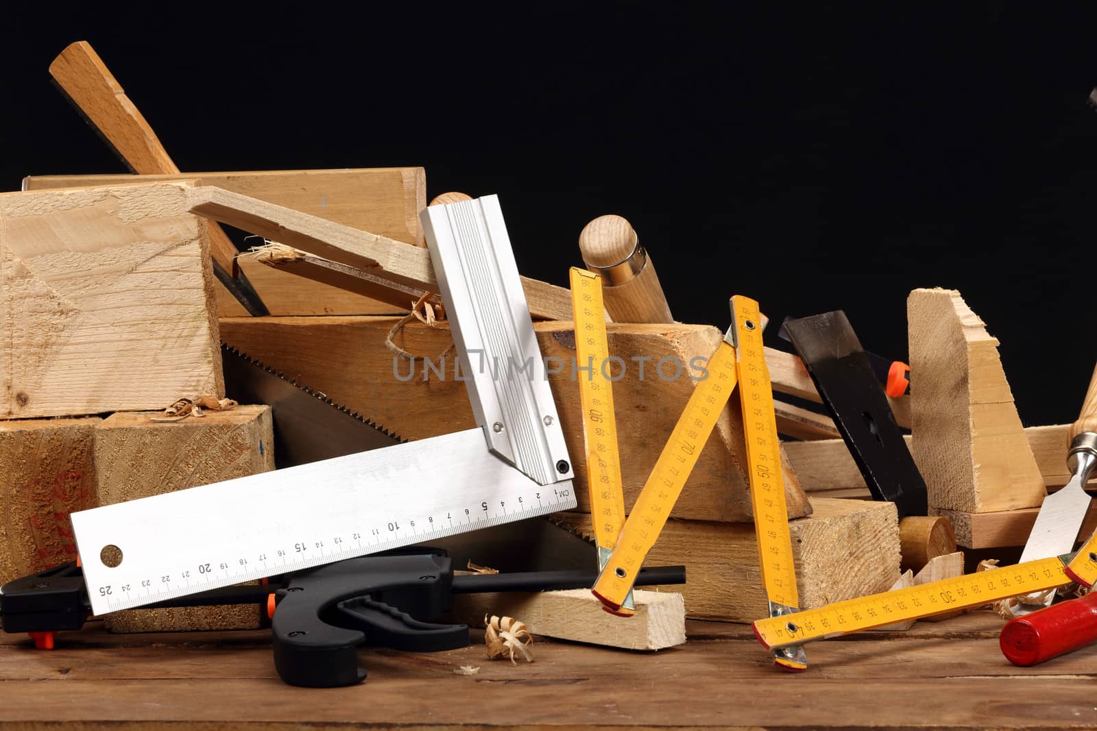 carpenter's tools close up over black