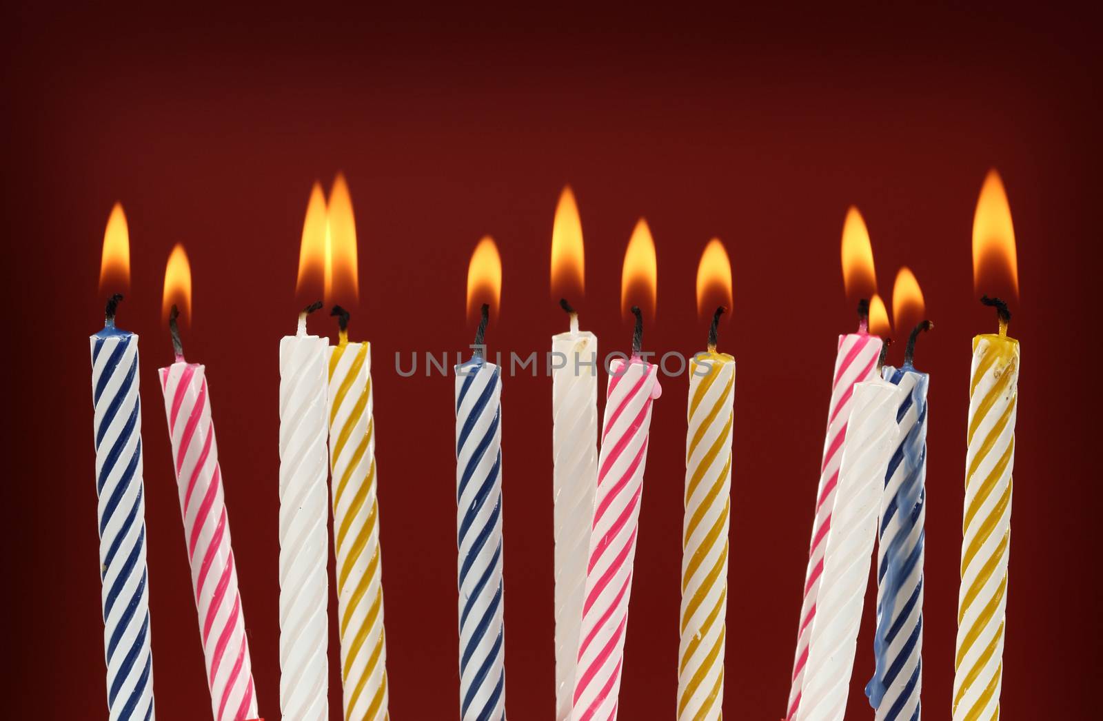 Some lit birthday candles close up