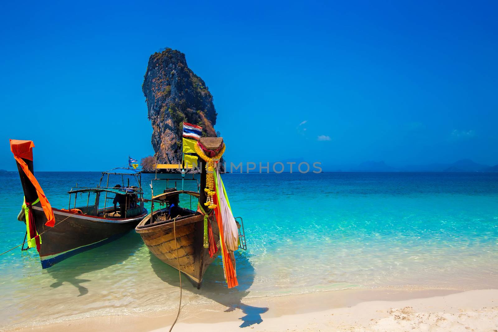 Poda Island surrounded by blue skies and crystal clear water
