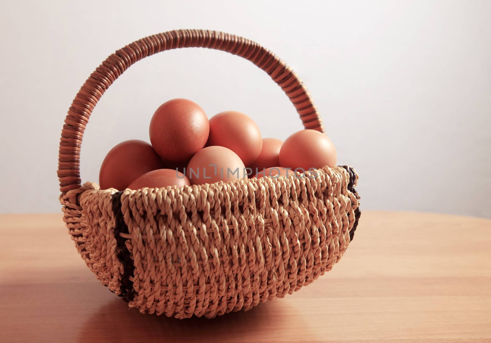 Chicken brown eggs  in in a wicker basket
