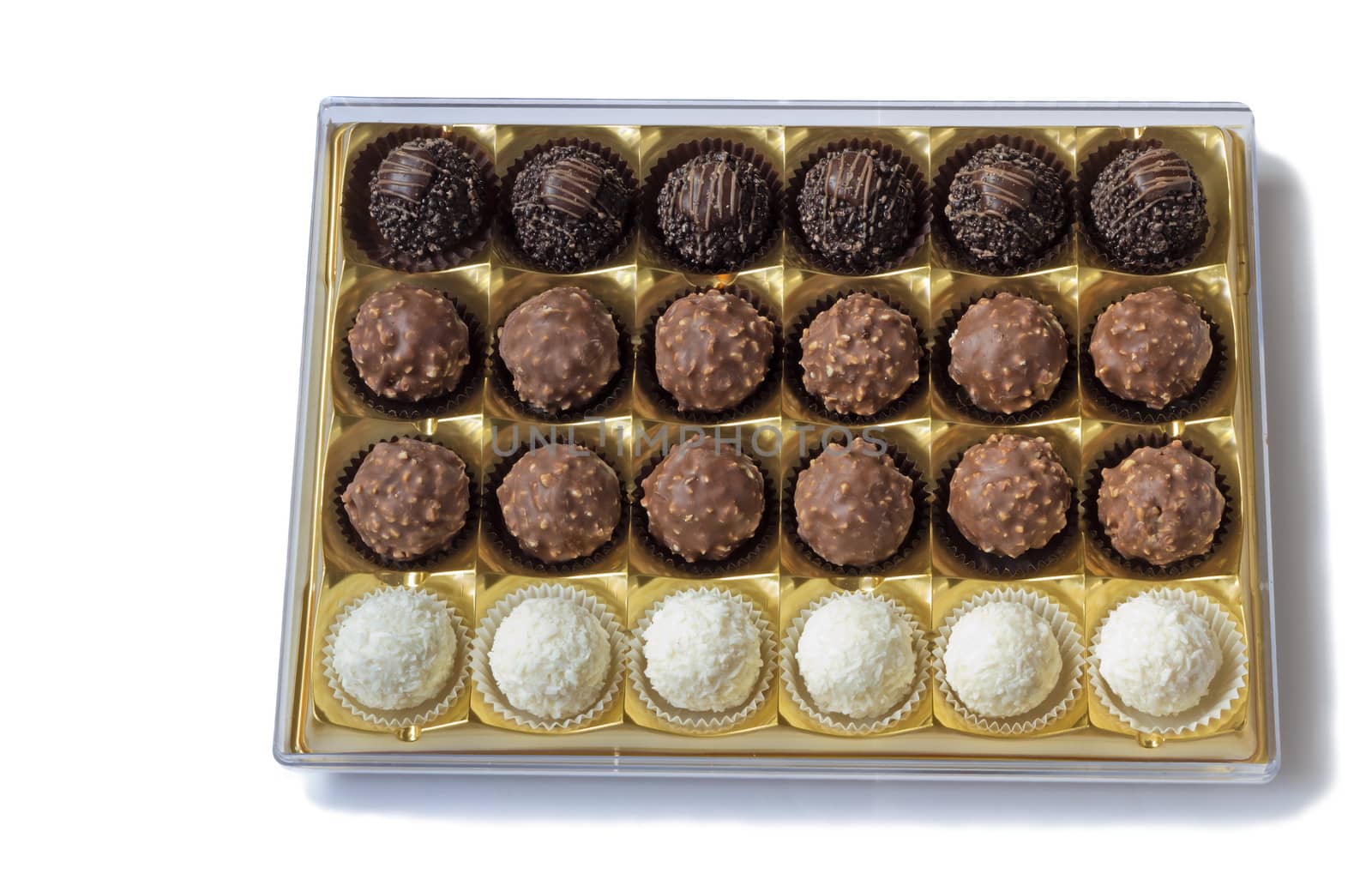 Fragment of the open blue boxes of chocolates. Presented on a white background