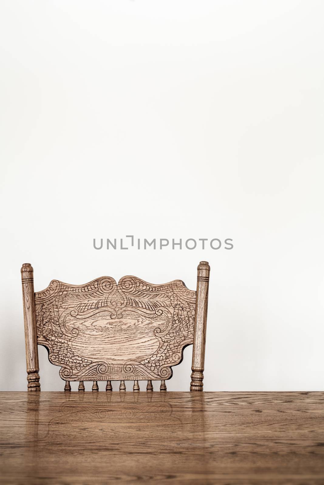 Wooden Dining room table and chair details and blank wall for your text, image or logo.