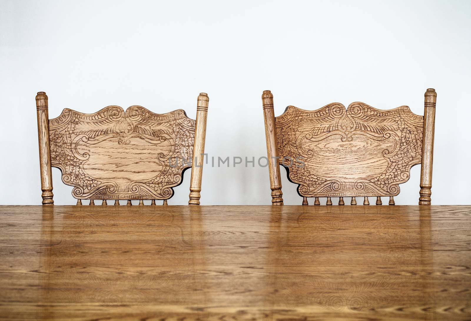 Wooden Dining room table and chair details and blank wall for your text, image or logo.