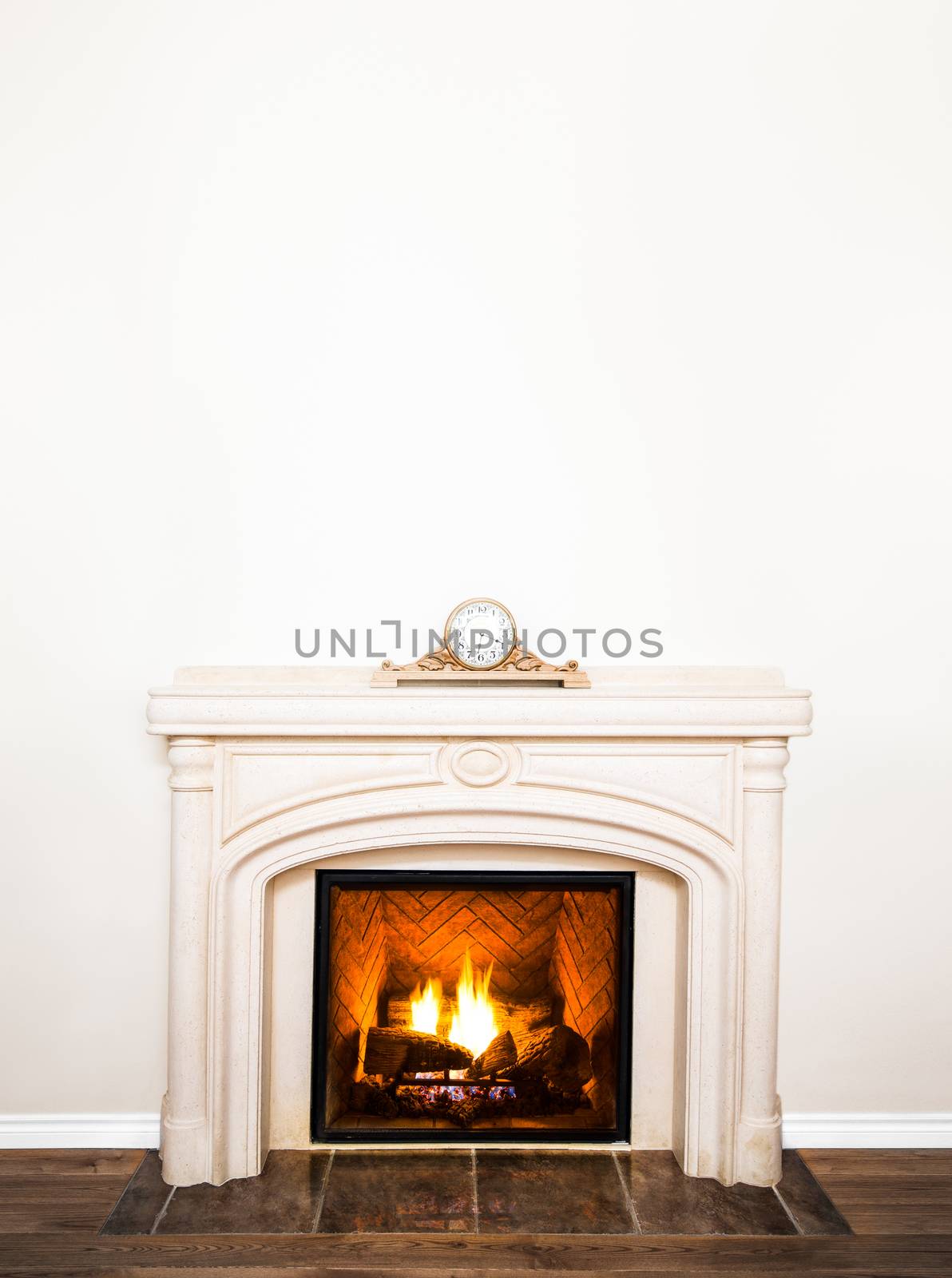 Luxurious White Marble Fireplace and empty wall for your text, logo, images, etc