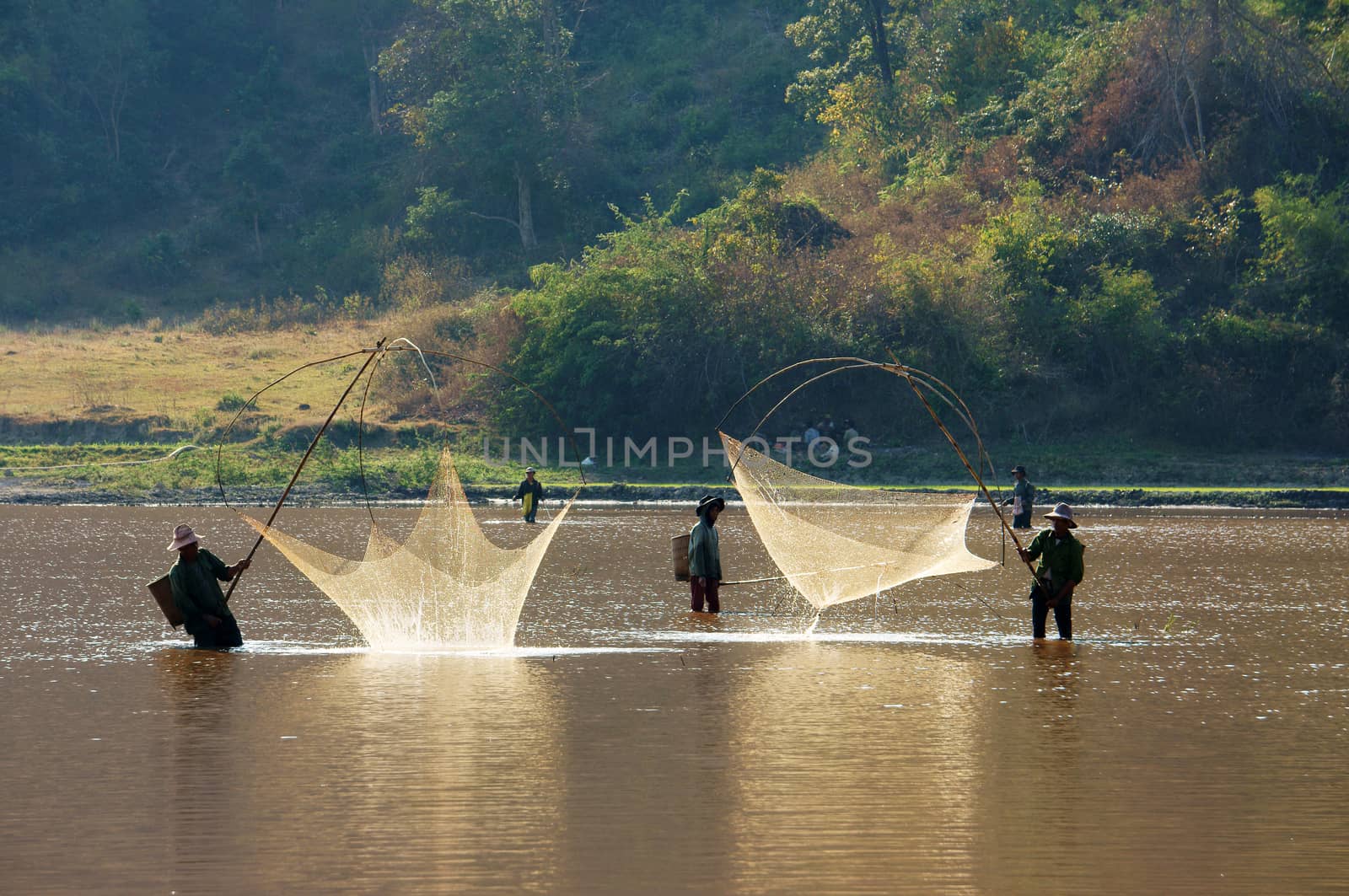 People catch fish by lift net on ditch by xuanhuongho