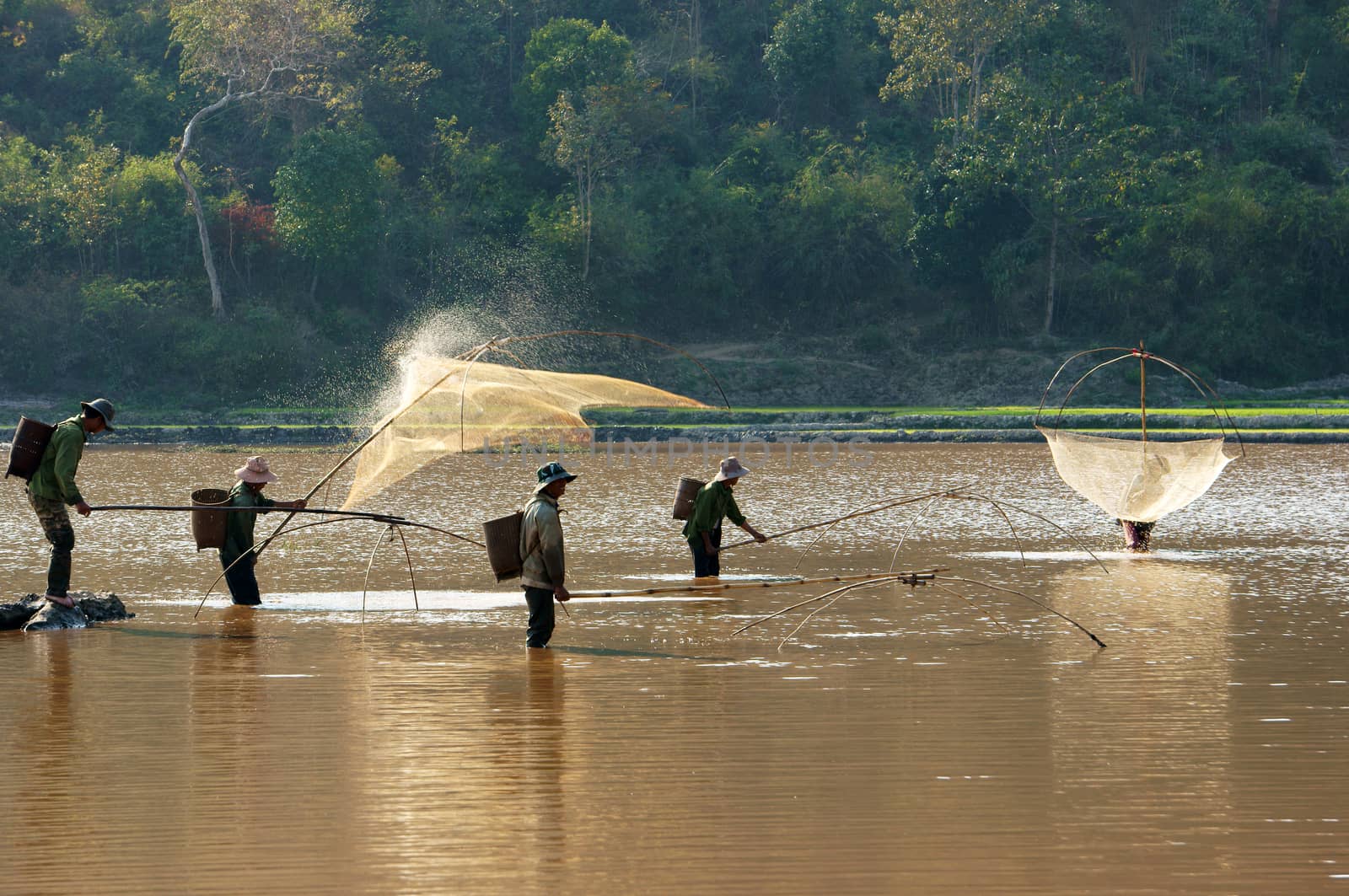 People catch fish by lift net on ditch by xuanhuongho